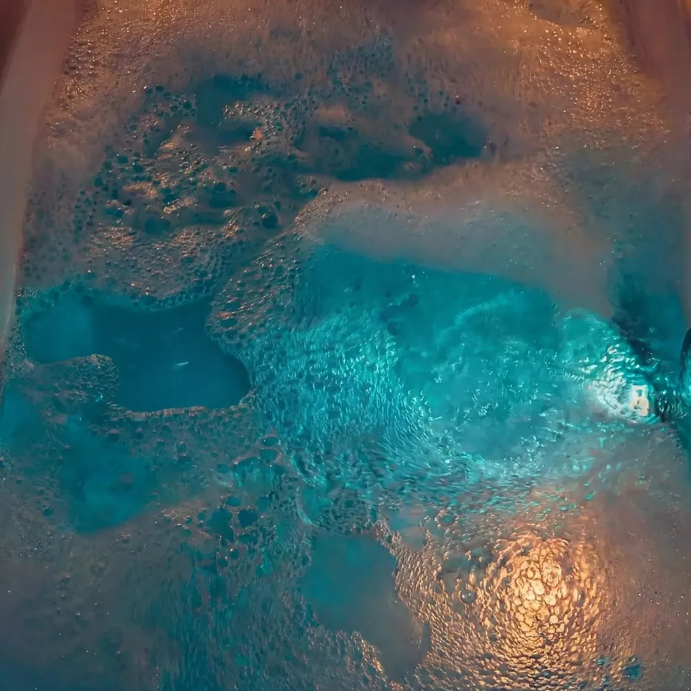 Chromotherapy lights glowing turquoise in the water